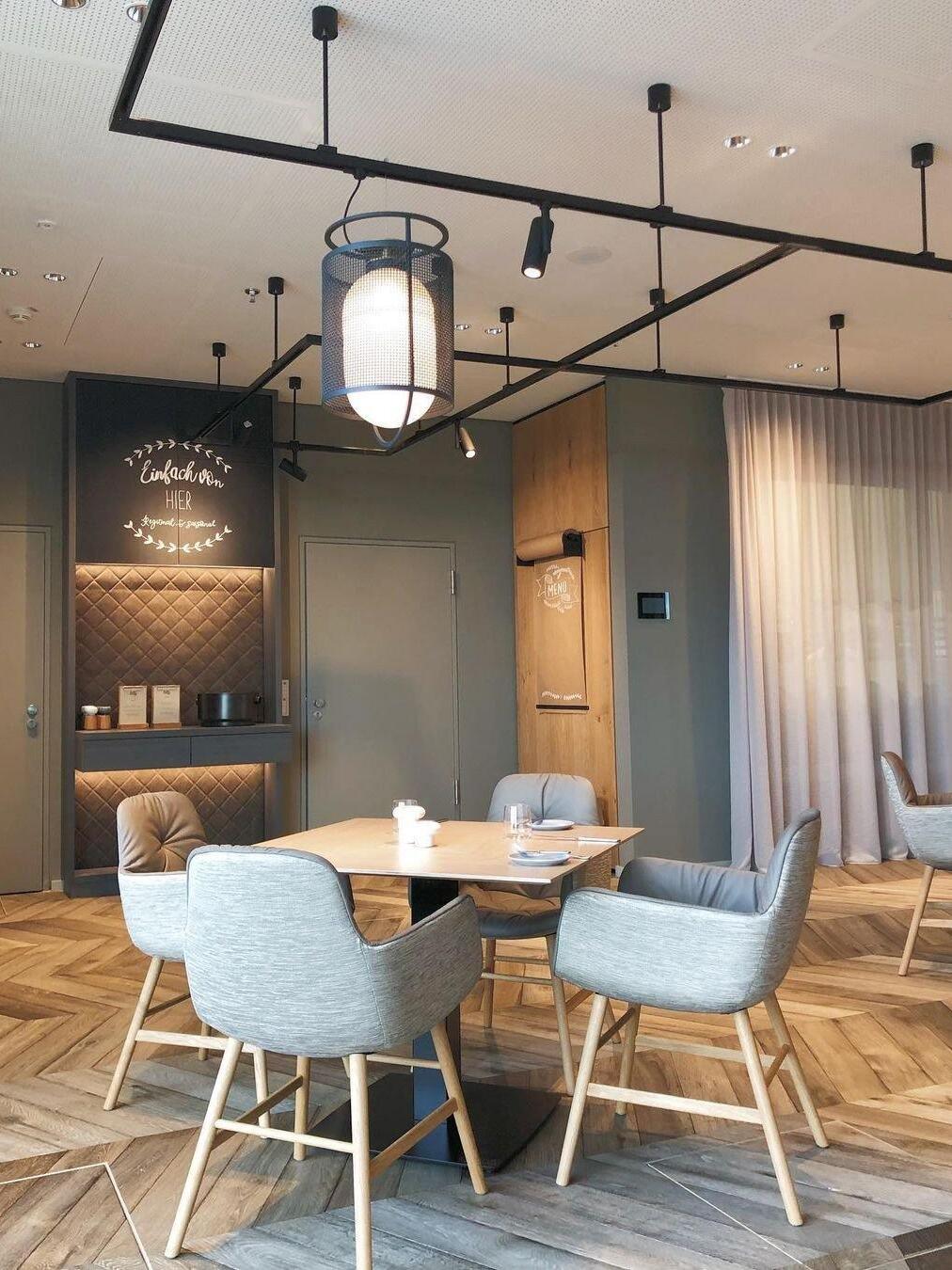 Black lantern pendants above restaurant dining tables