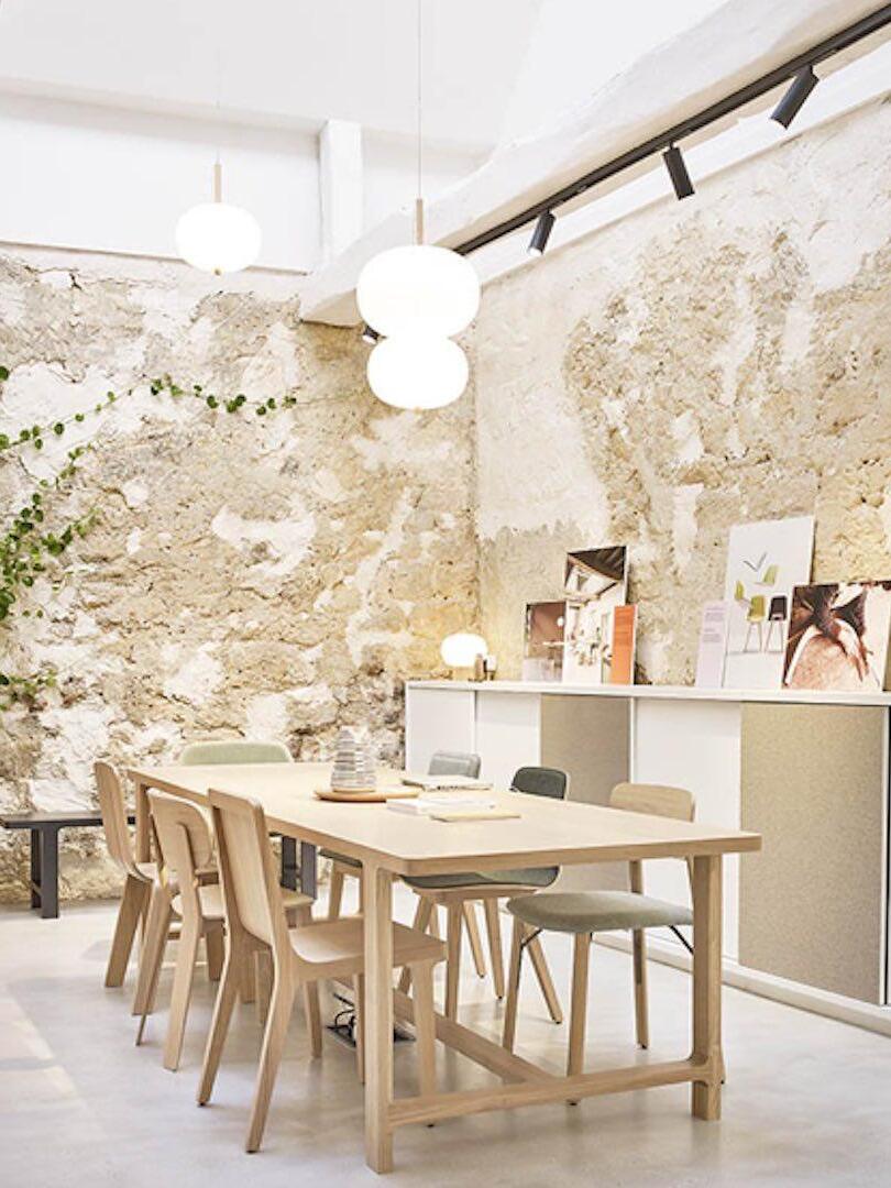 White globe pendants in a bright dining interior