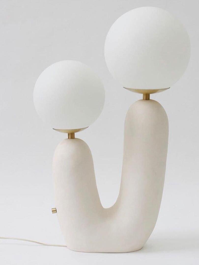 White U-shaped lamp with Gold-toned globe collars