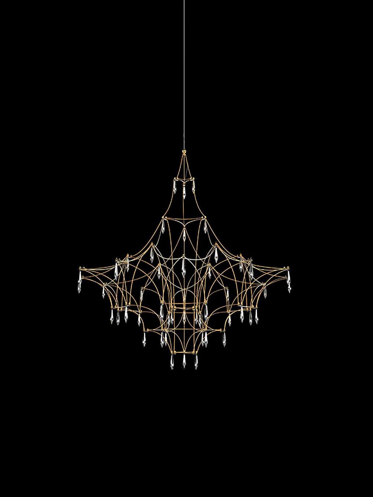 Gold-coloured curved lattice with small light points and hanging crystal drops