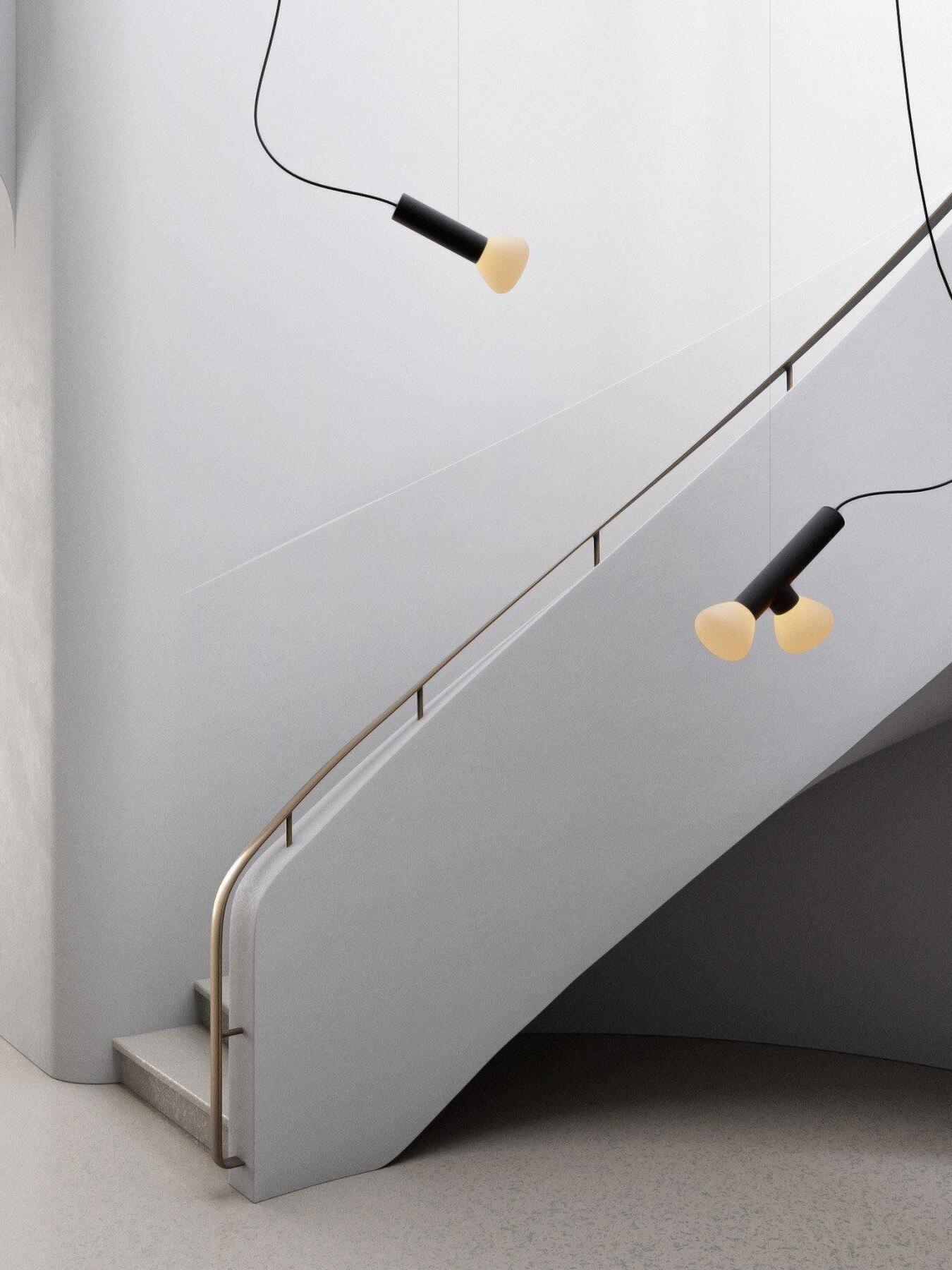 Single and two-head pendant arrangements beside a stair rail