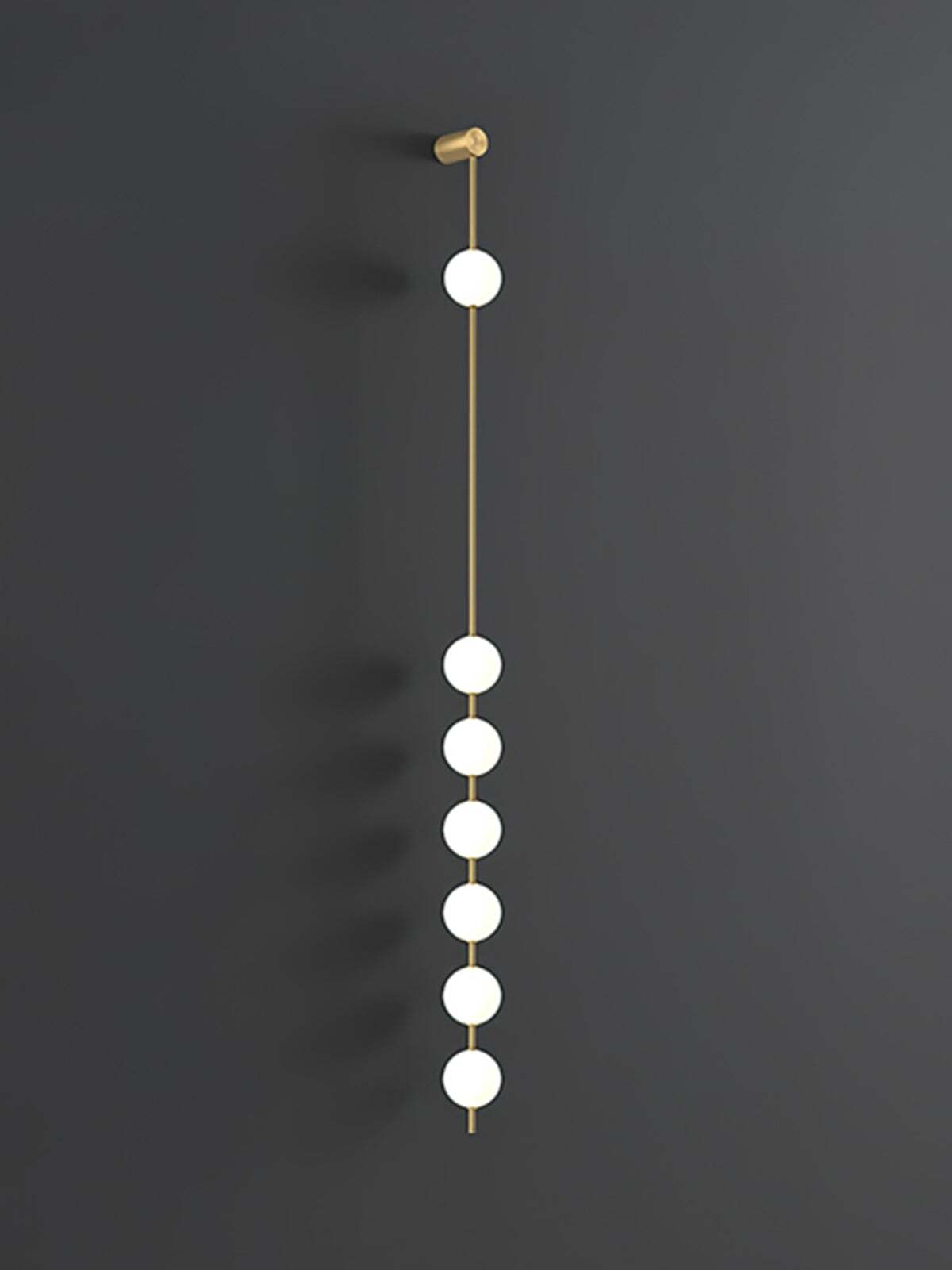 Enlarged seven-globe wall lamp with lit white spheres on a gold-colour rod against dark grey