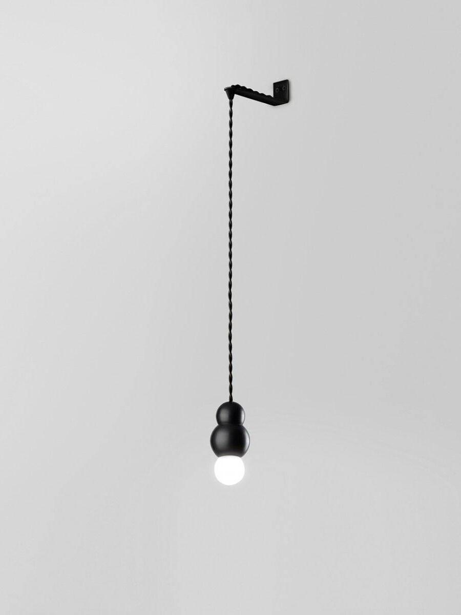 Black Flex wall light with twisted cord and small bulb