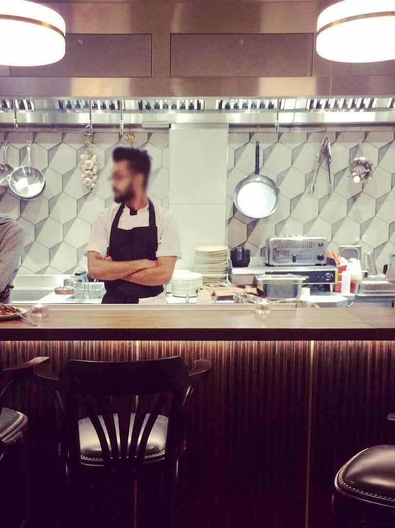 Hanging lights above a hospitality counter