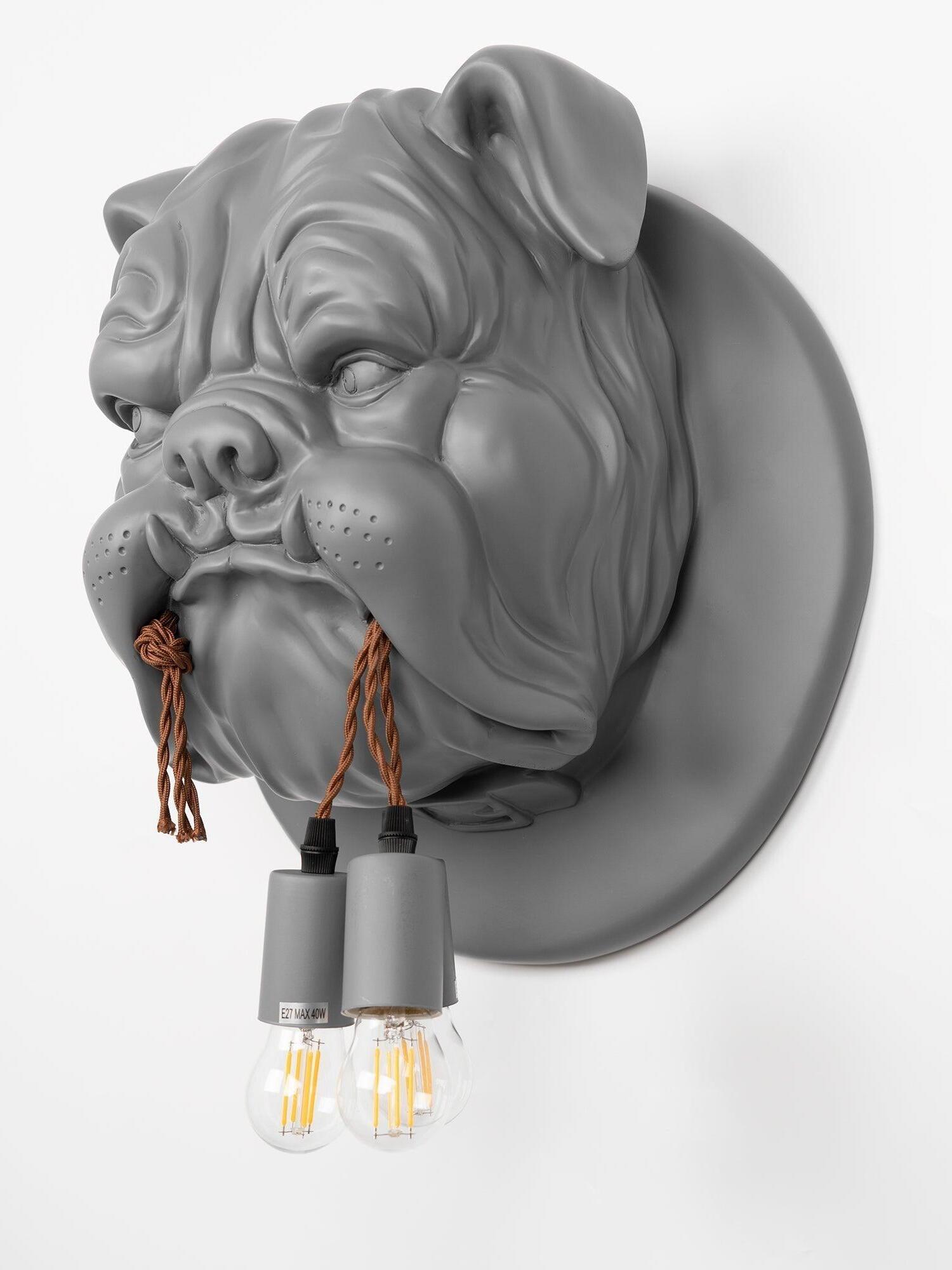 Grey sculpted bulldog sconce viewed at an angle