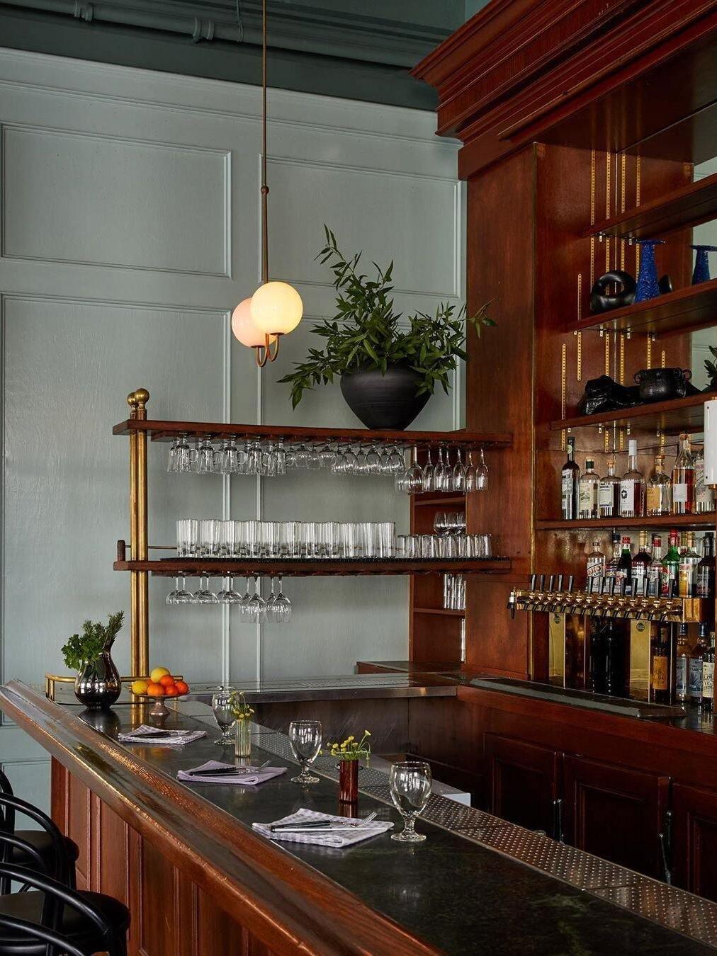 Single Opal globe pendant above a bar counter