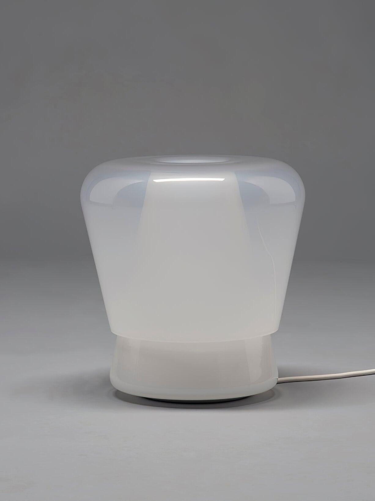 White rounded glass Jumelle lamp with cord visible