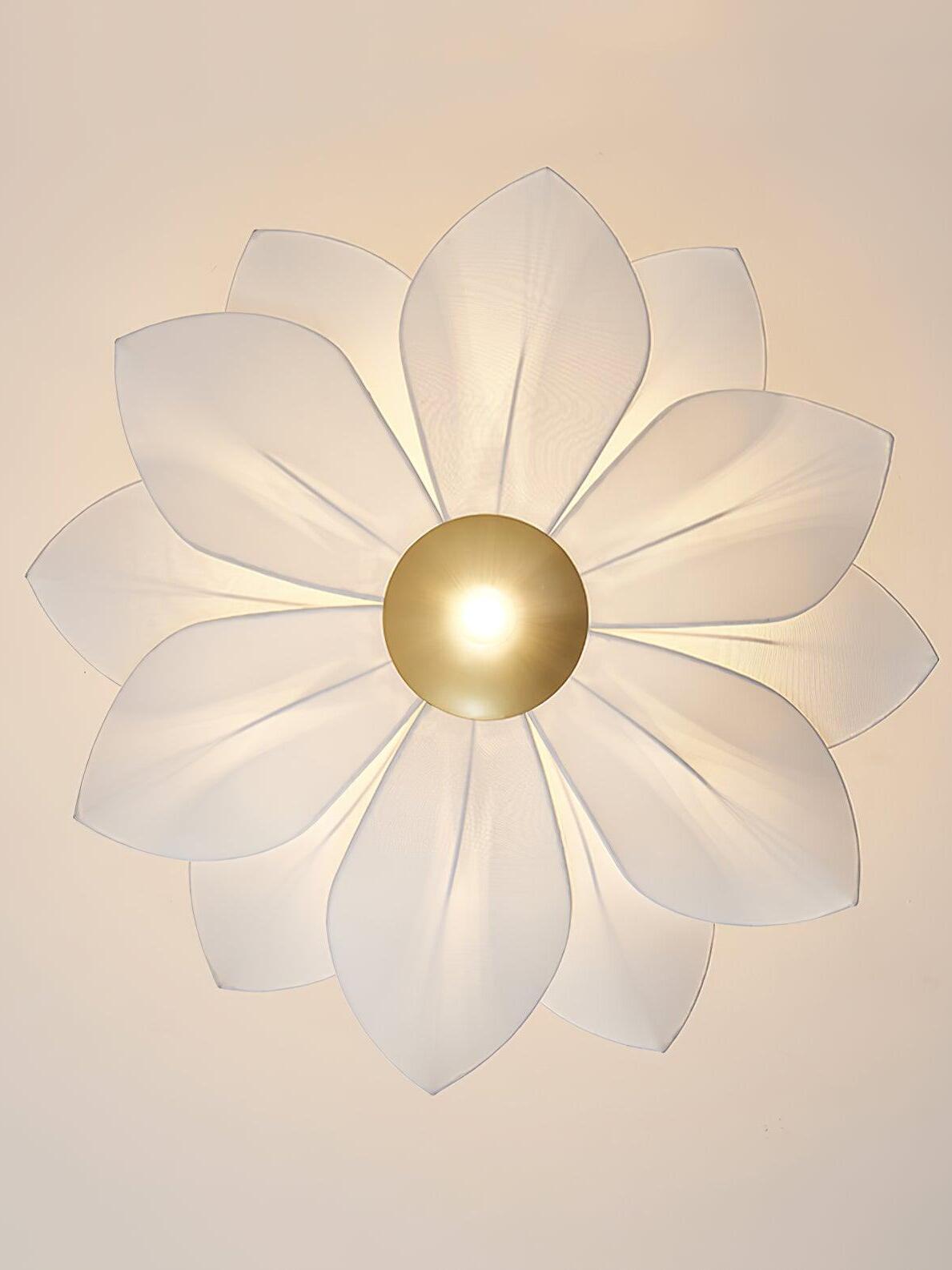Underside of white fabric petals around gold disc