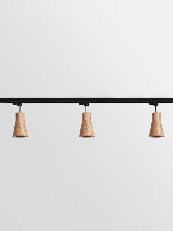 Three pale tapered wooden spots on longer bar