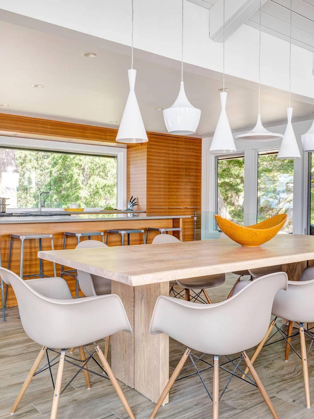 White mixed-shape pendants above a wood table