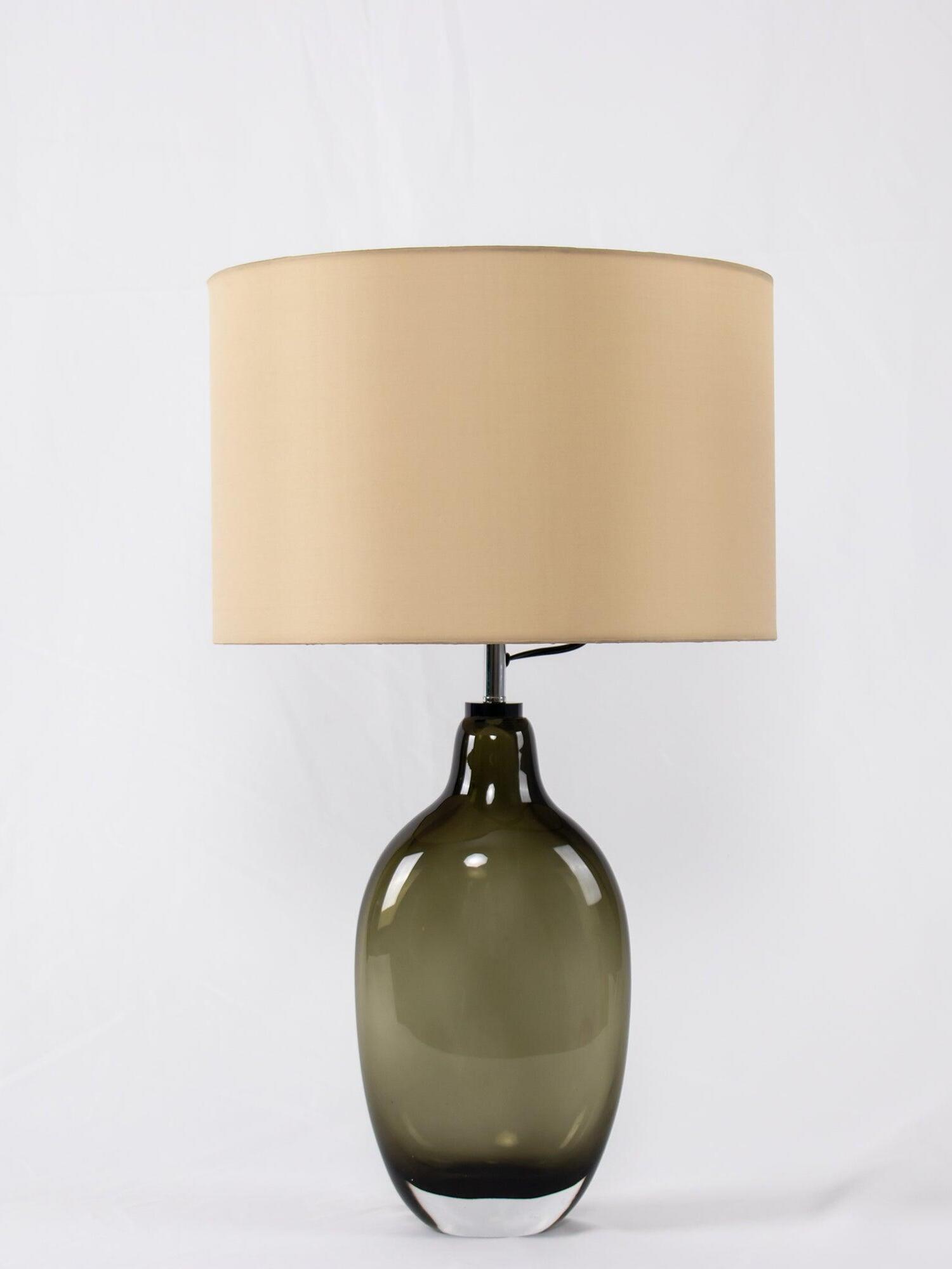 Isolated smoky-base lamp with pale beige drum shade