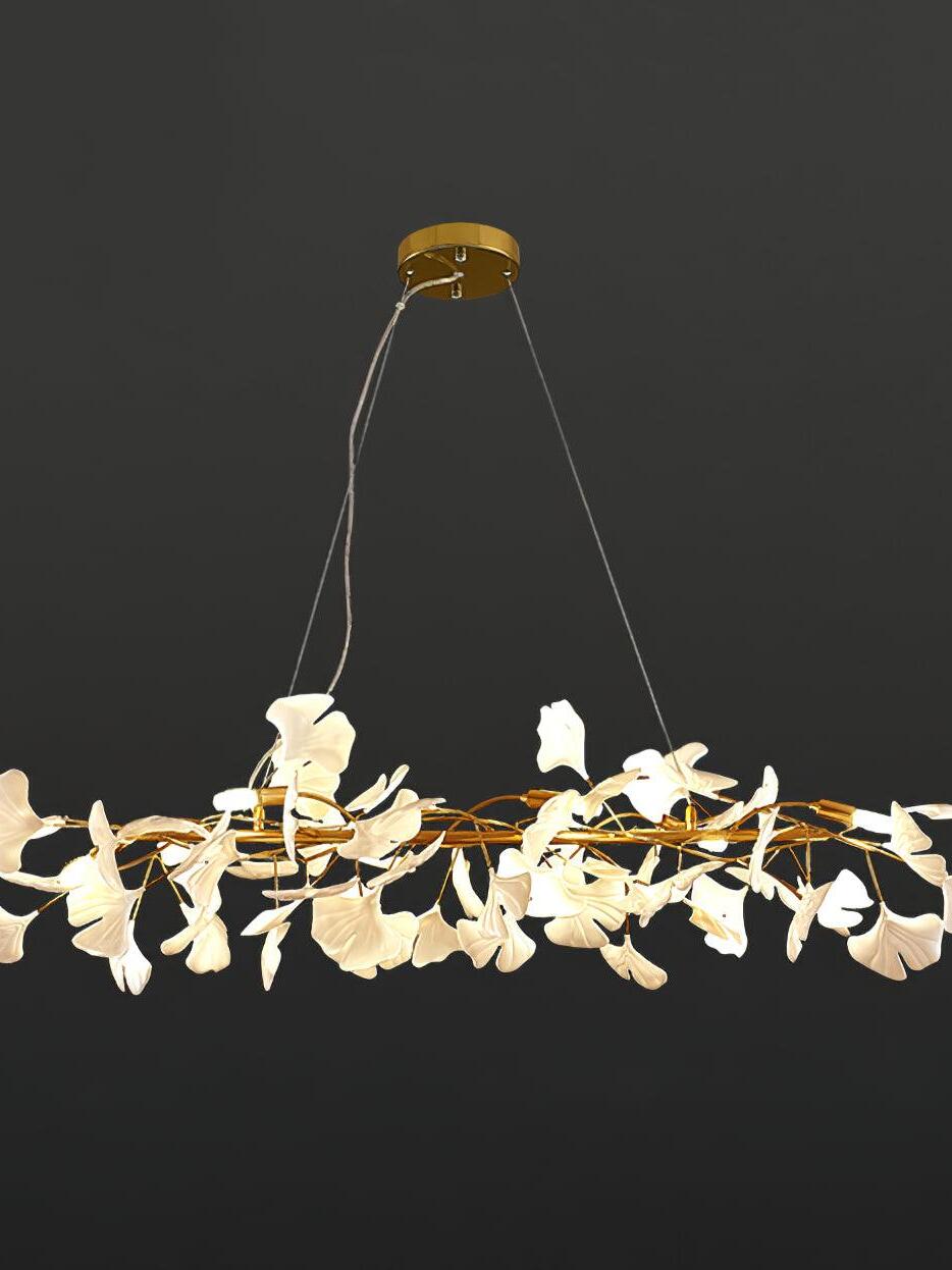 Gold and white Gingko M chandelier suspended from a round canopy