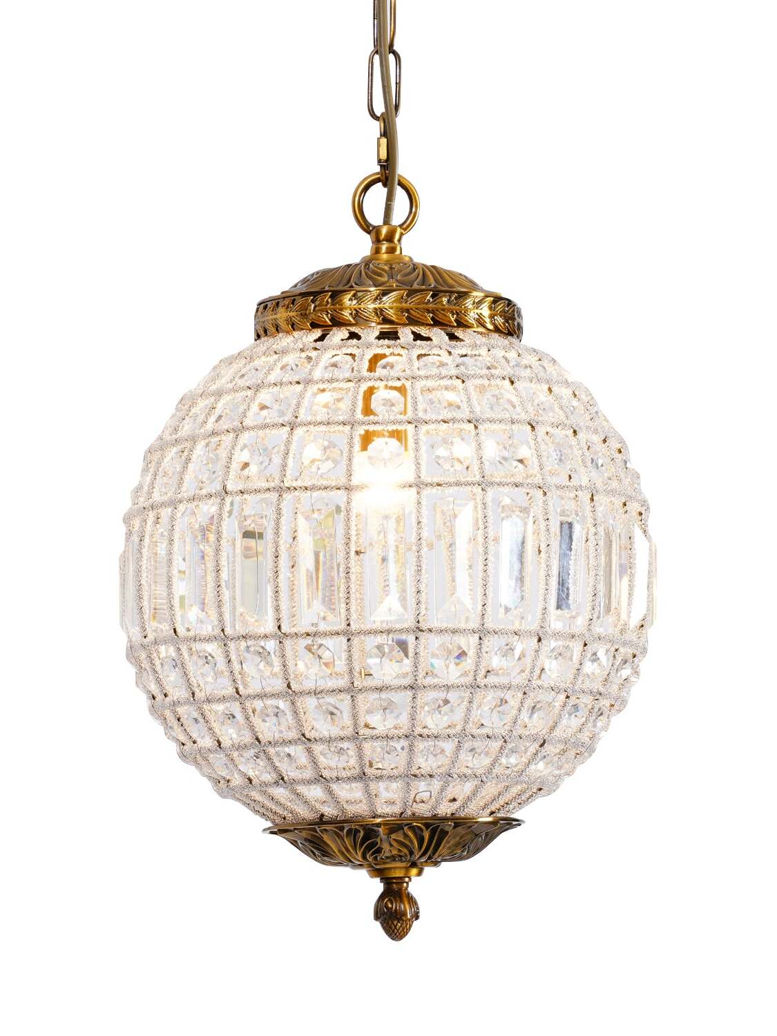 Lit clear crystal globe with an ornate gold-tone cap, cropped chain and decorative bottom finial