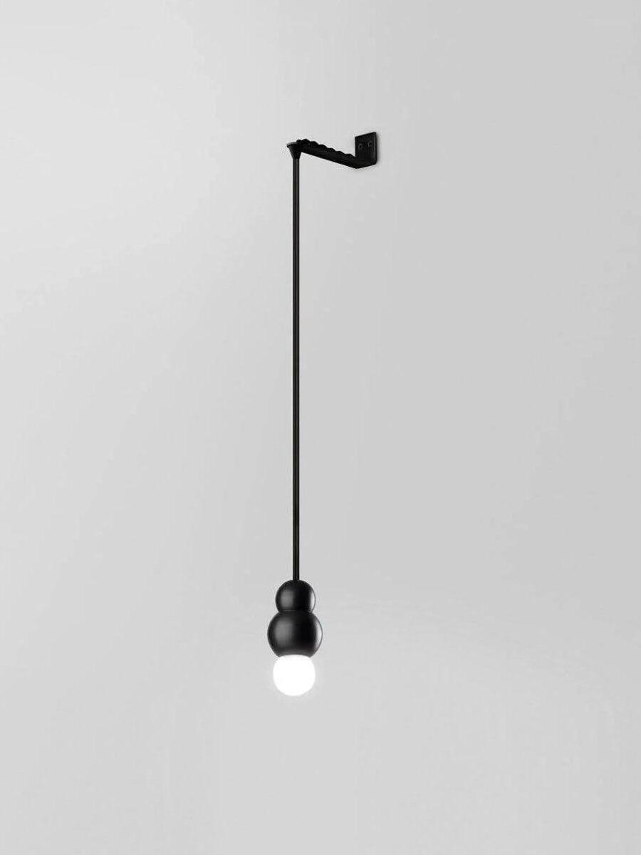 Black wall-mounted straight drop with compact round bulb