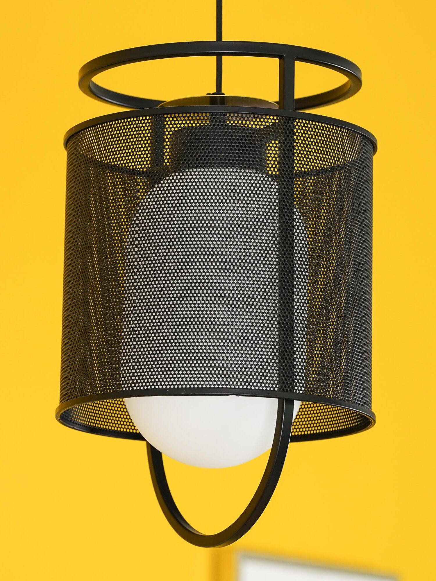 Glowing pale diffuser behind black mesh on yellow backdrop