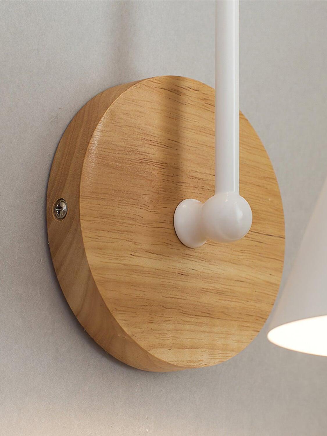 Close view of wooden wall plate and white arm connection