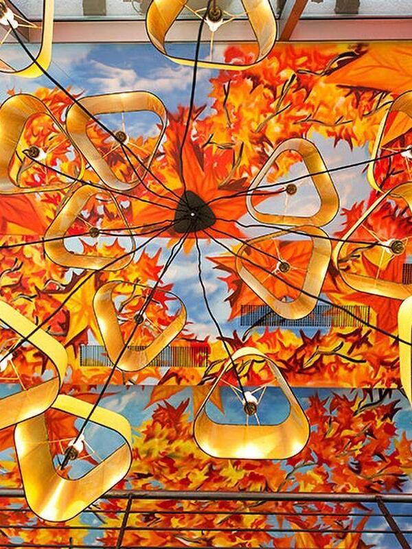 Gallery multi-shade ceiling arrangement against colourful artwork