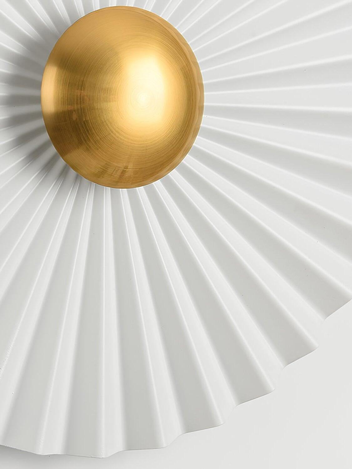 Close view of gold dome and white radial pleats