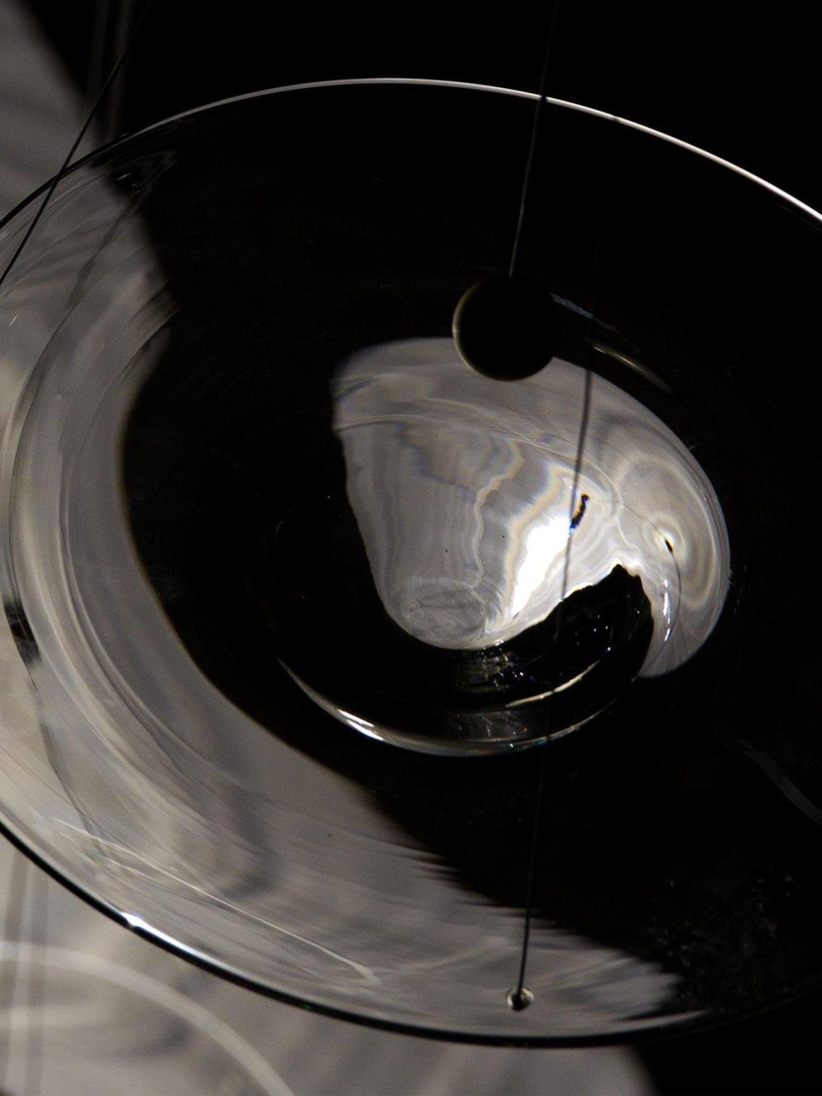 Underside of glass disc and downward central bowl