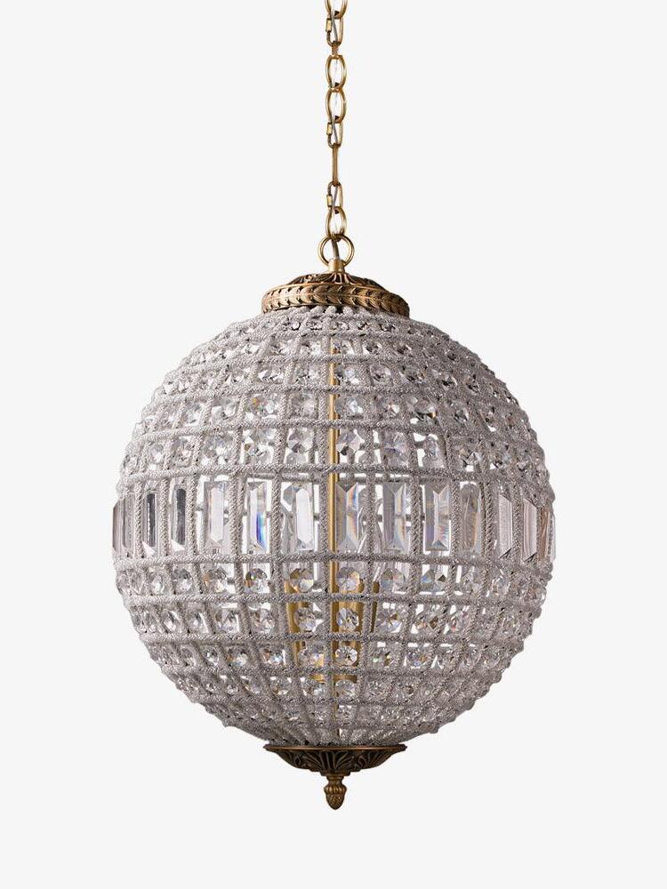 Unlit crystal globe with round faceted pieces, a rectangular middle band, gold-tone ornaments and short chain