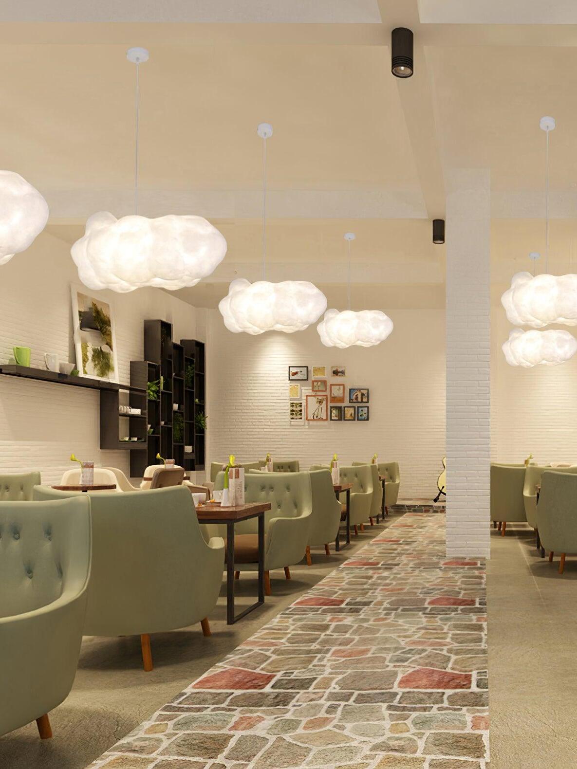 Cloud lights above a row of cafe tables