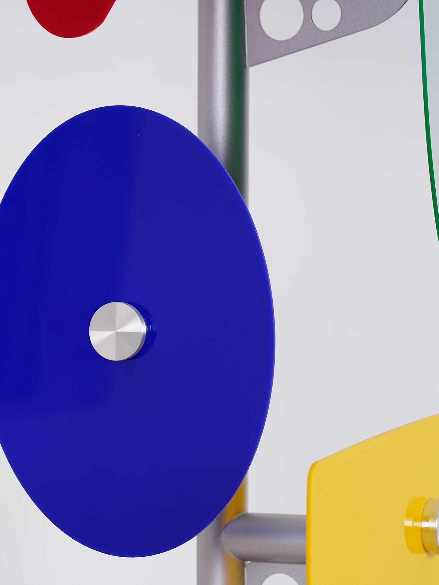 Blue circular panel and silver support