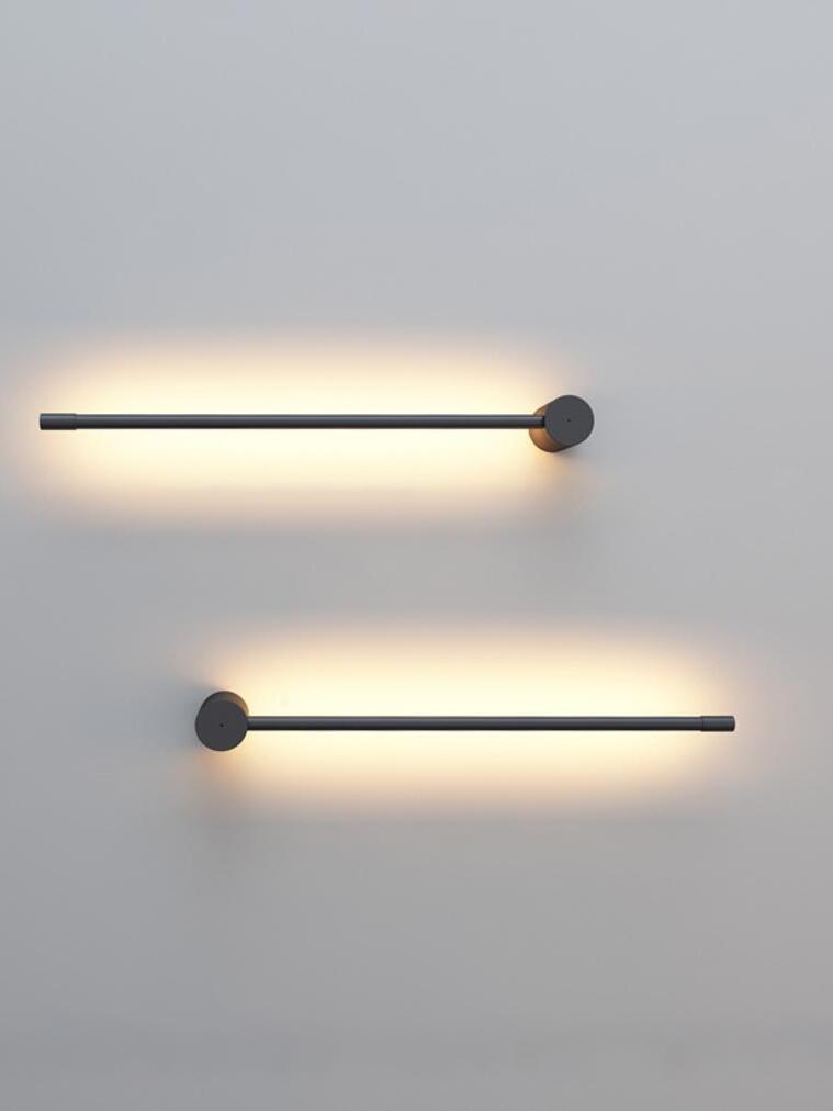 Two horizontal black rods on a pale wall