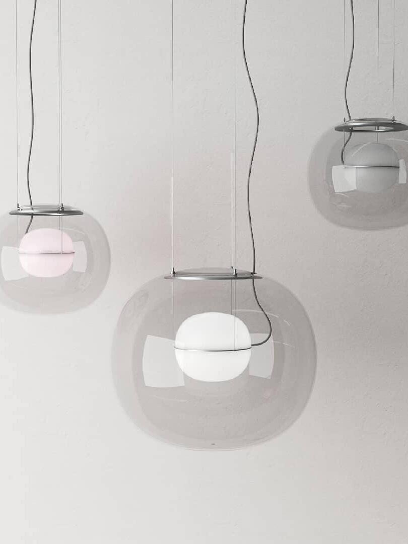 Clear glass pendants with pale illuminated inner spheres