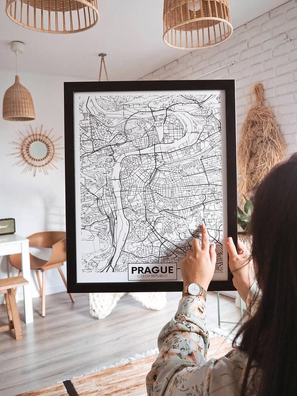 Woven pendants in an interior with framed map