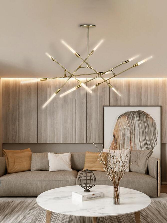 Gold branching chandelier over round coffee tables