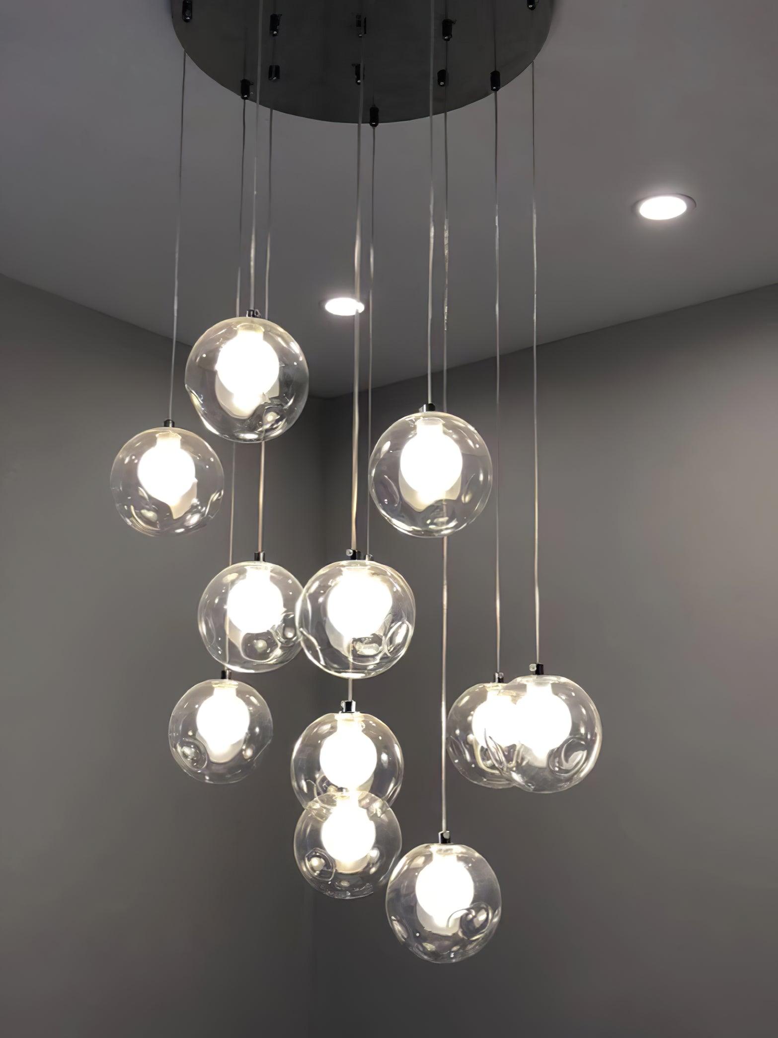 Clear globe group hanging from round ceiling plate