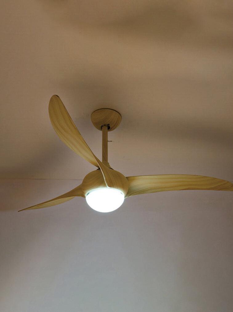 Light woodgrain-looking curved blades and illuminated round diffuser beneath a matching ceiling rod and canopy