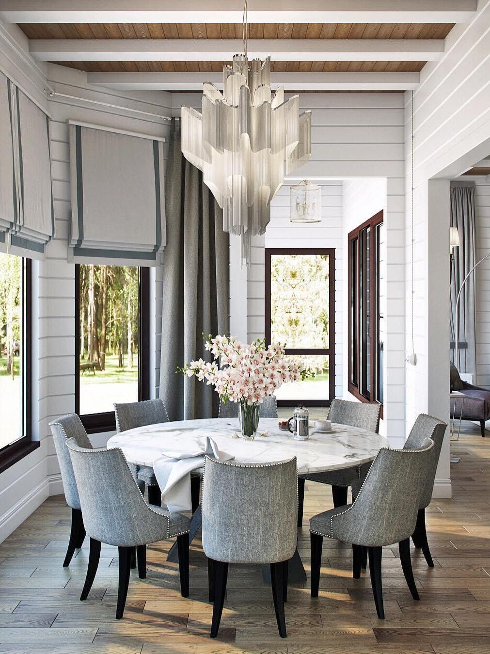 Silver chain chandelier above a round dining table