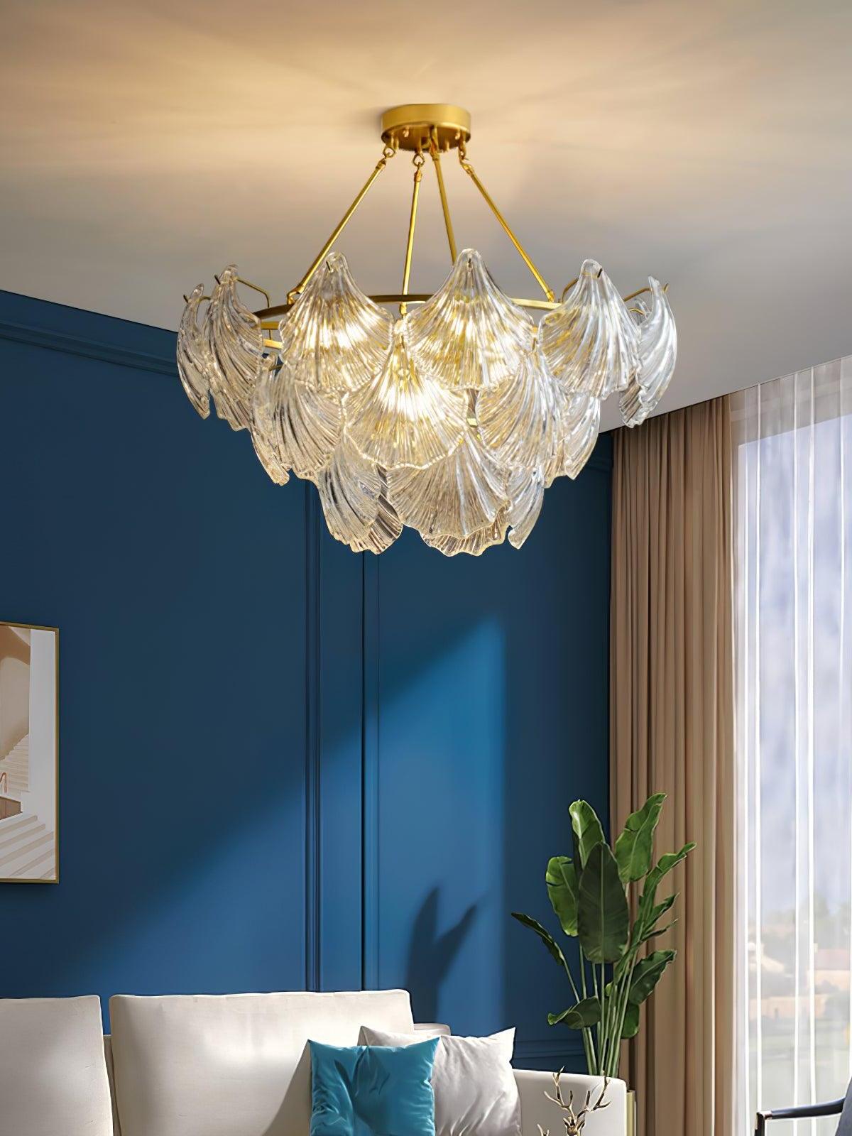 Illuminated shell-panel ceiling light above a sofa in a blue paneled room with curtains