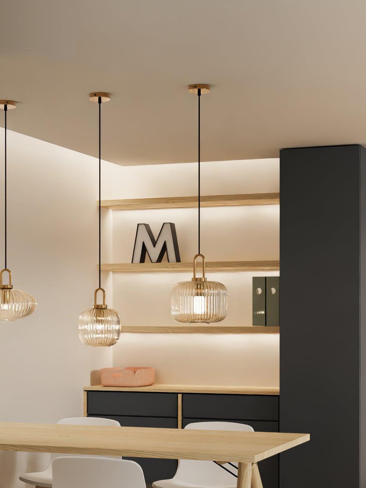 Separate pendants arranged over a kitchen counter