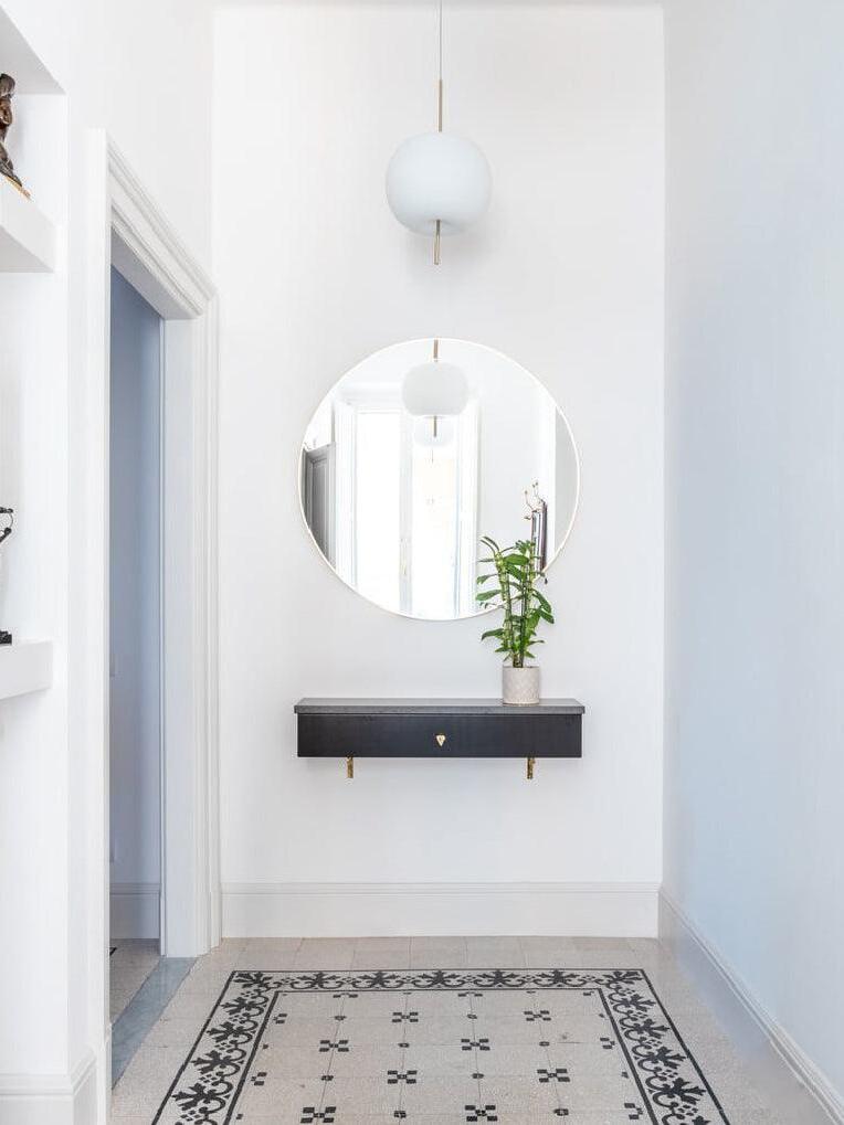 White glass lighting in a bright entrance setting