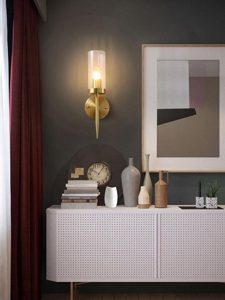 Single glass sconce above a console display