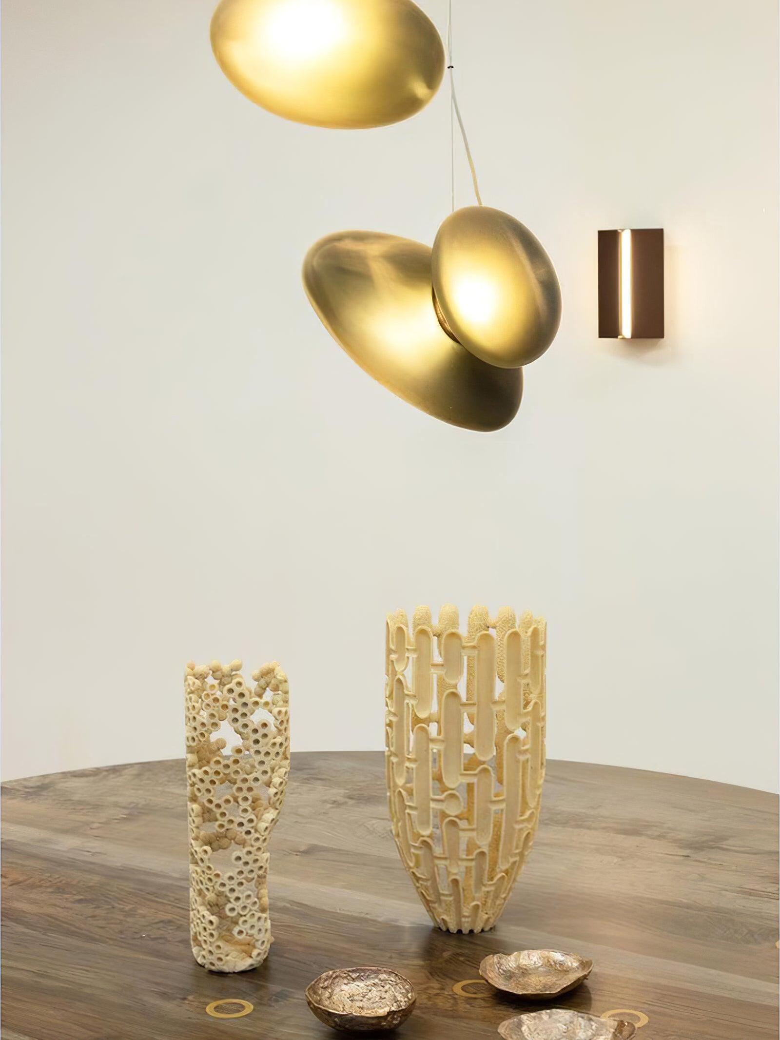 Amber and pale pebble surfaces glowing above a table