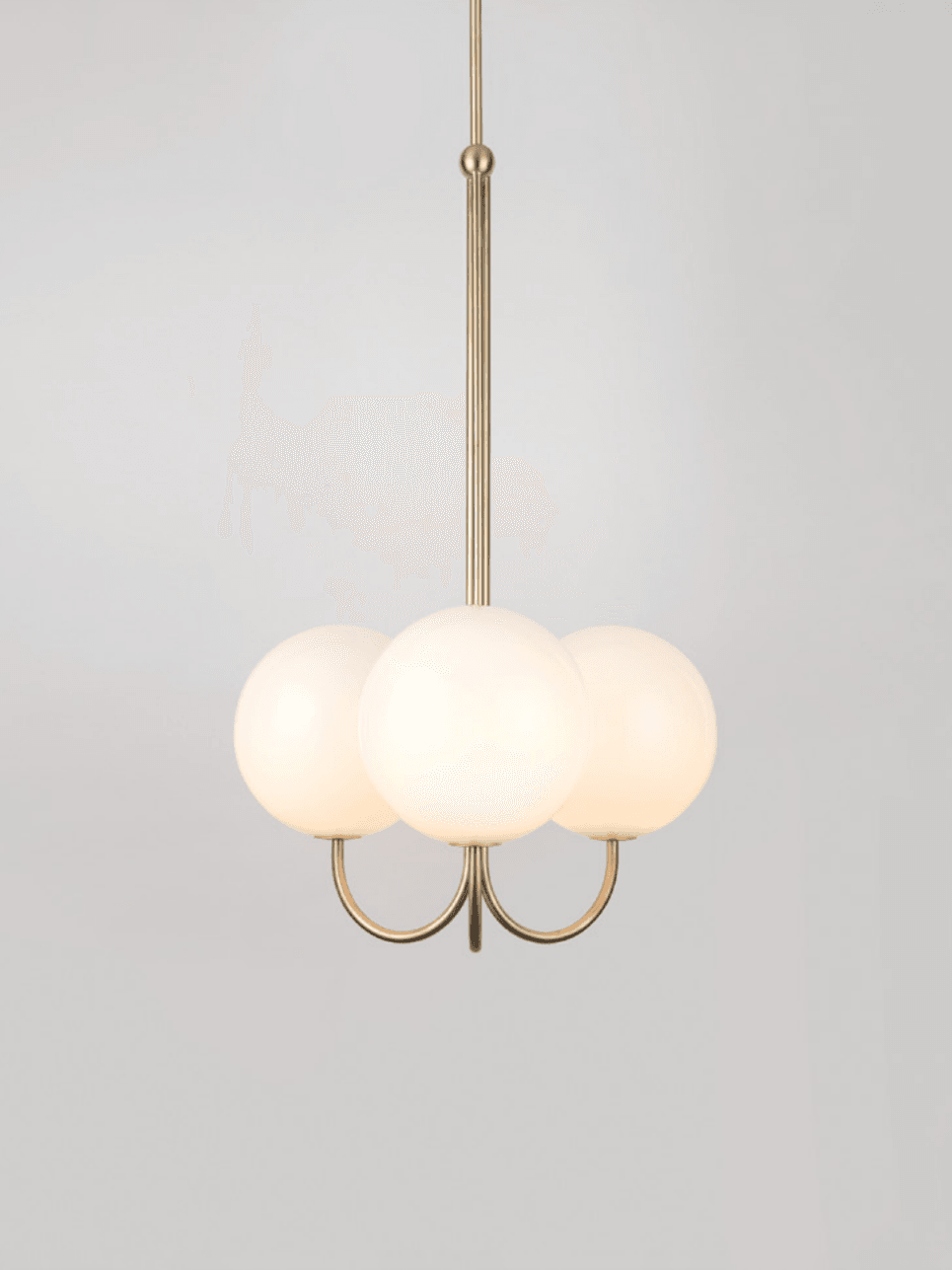 Three opal glass globes on curved brass arms around a central stem