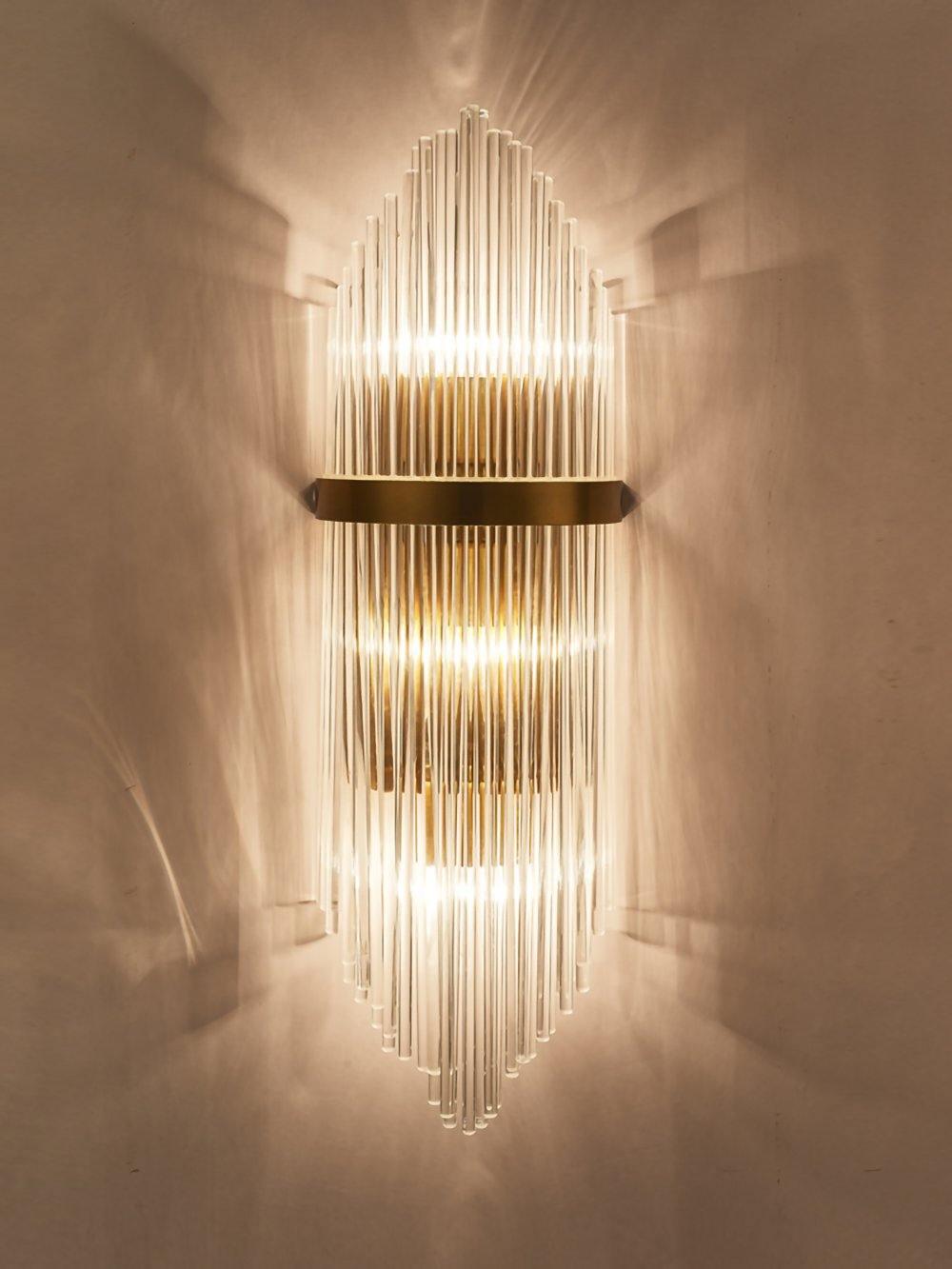 Bright crystal rod wall light casting patterns above and below