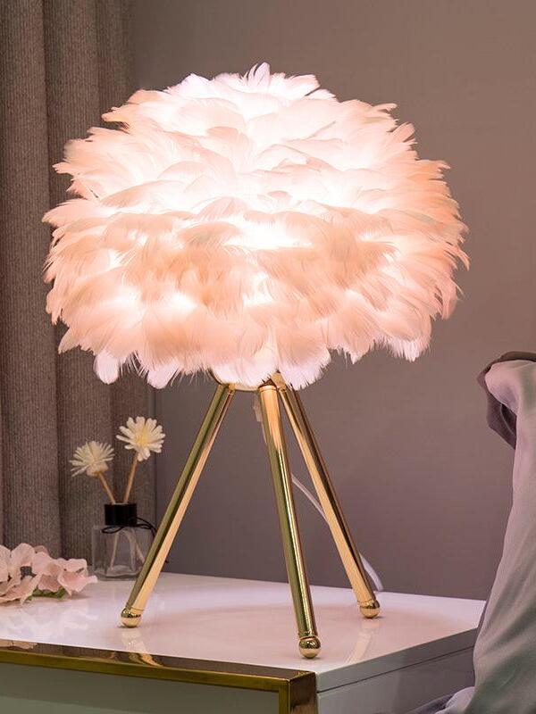 Pink feather lamp on gold tripod