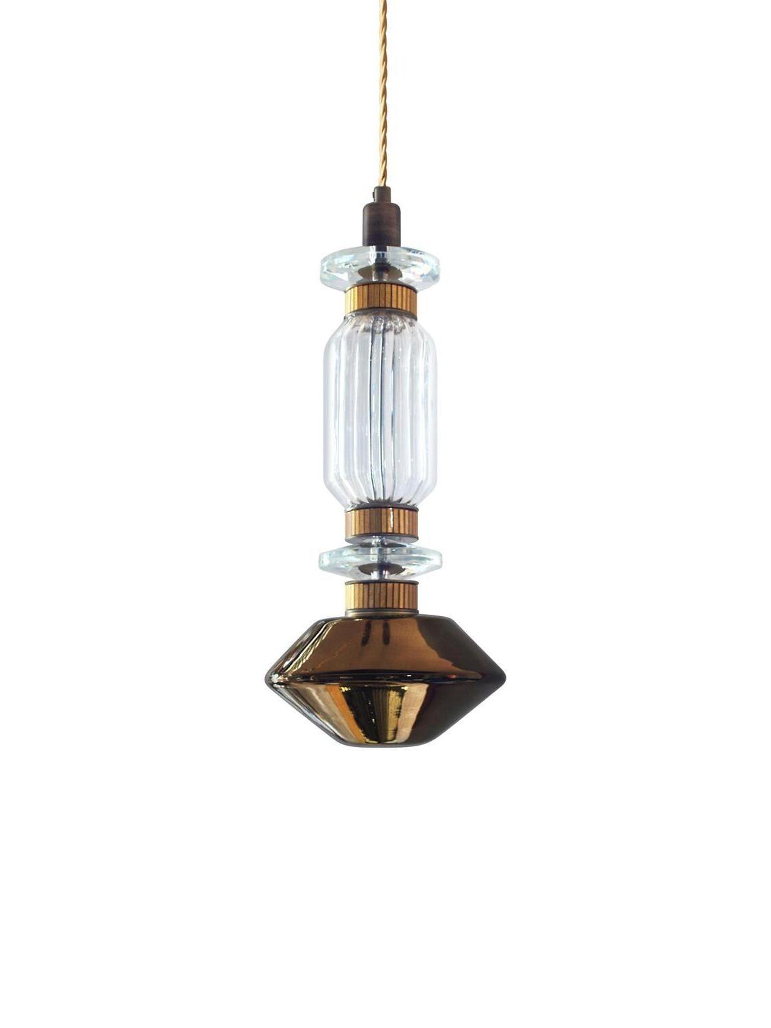 Short ribbed clear cylinder over dark amber pointed glass