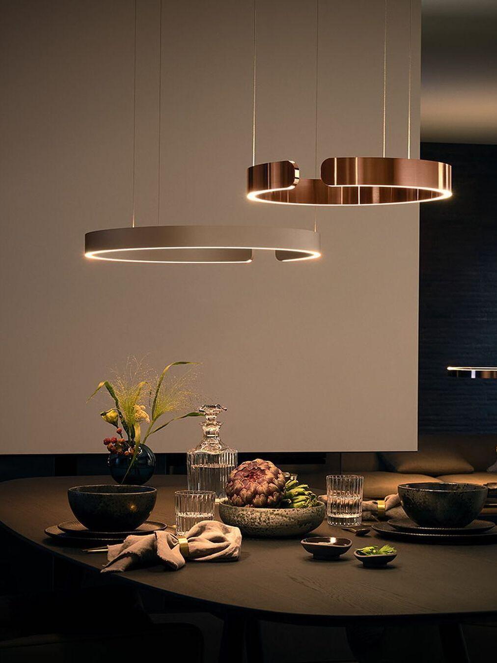 Pair of ring pendants over a set dining table