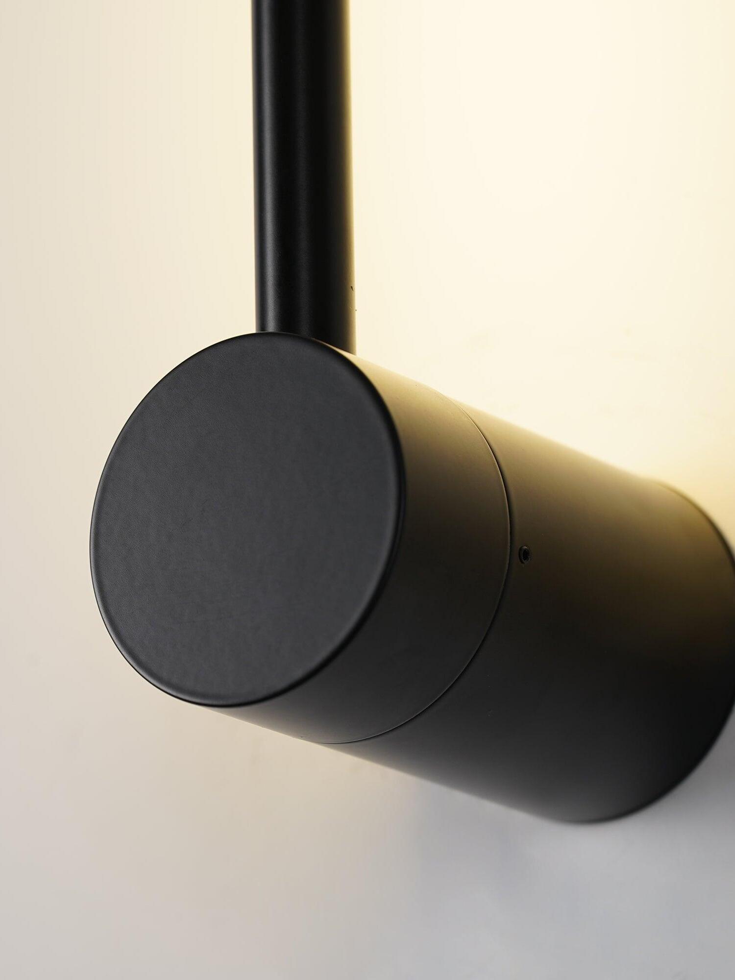 Close-up of the black mounting cylinder and wall glow