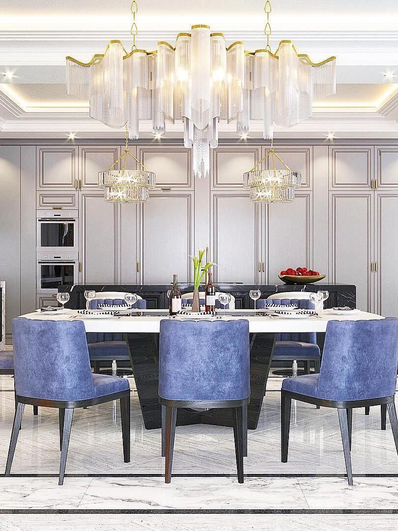 Long wavy chain chandelier over a dining table