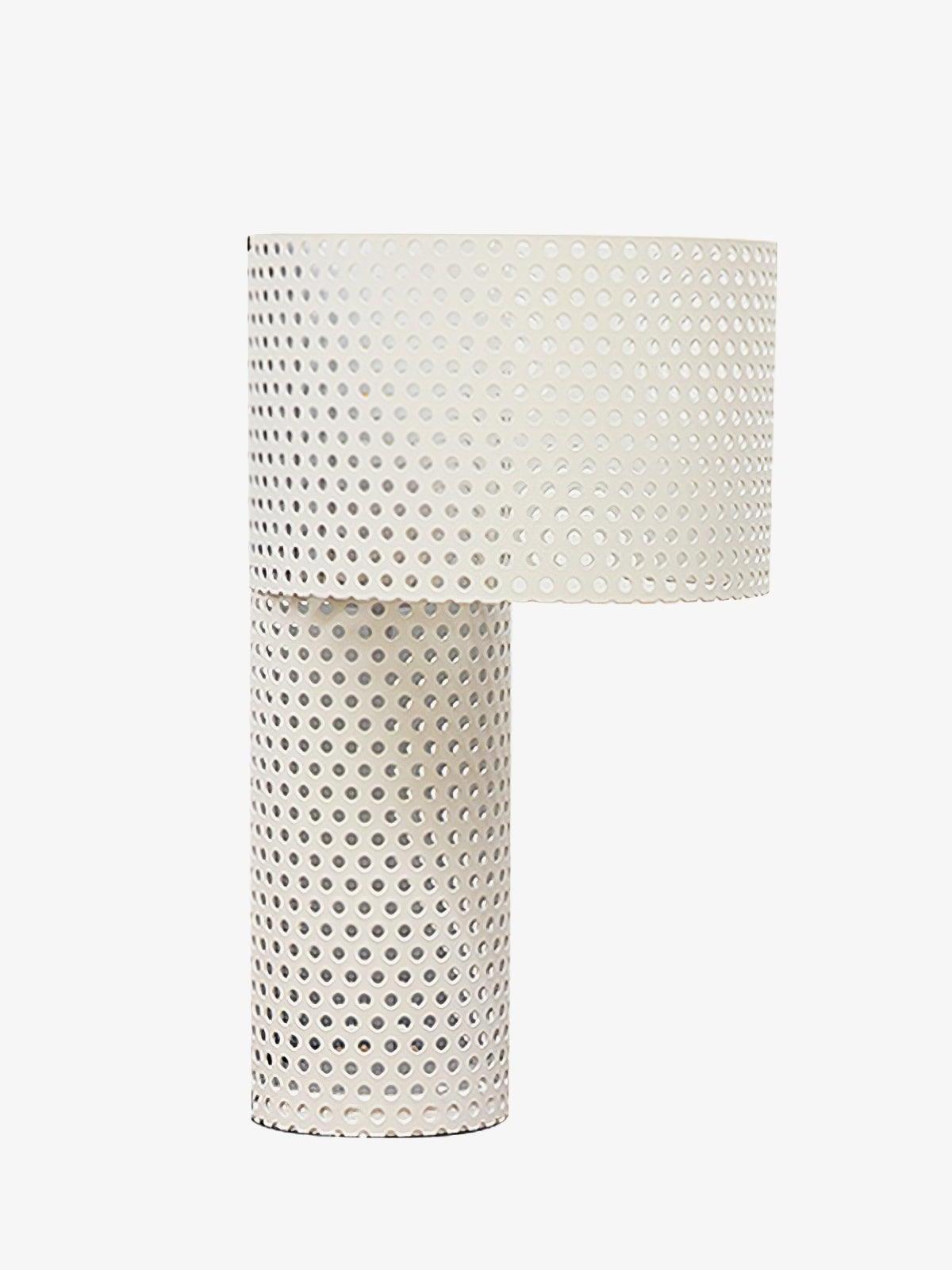 White perforated metal drum shade on narrow cylindrical base