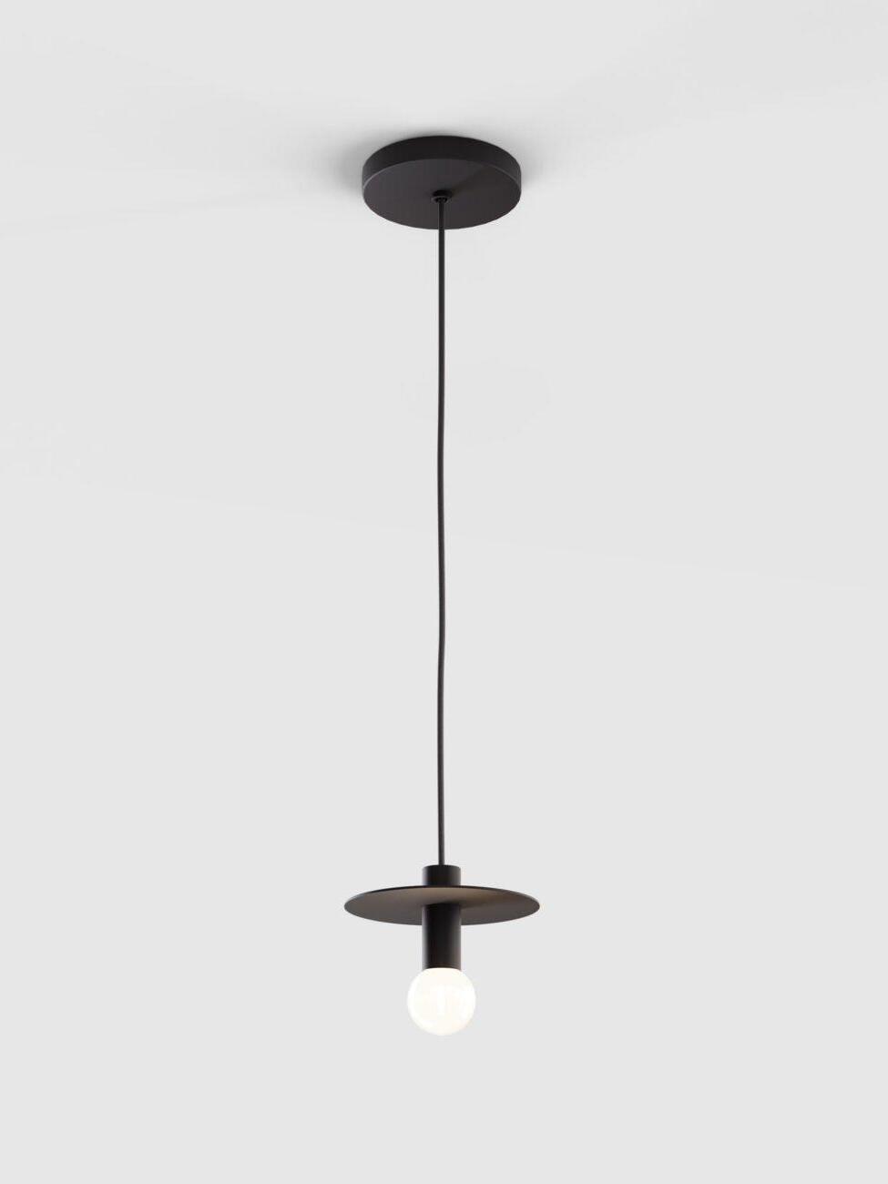 Full view of black disc pendant with round canopy, cord and exposed white globe bulb