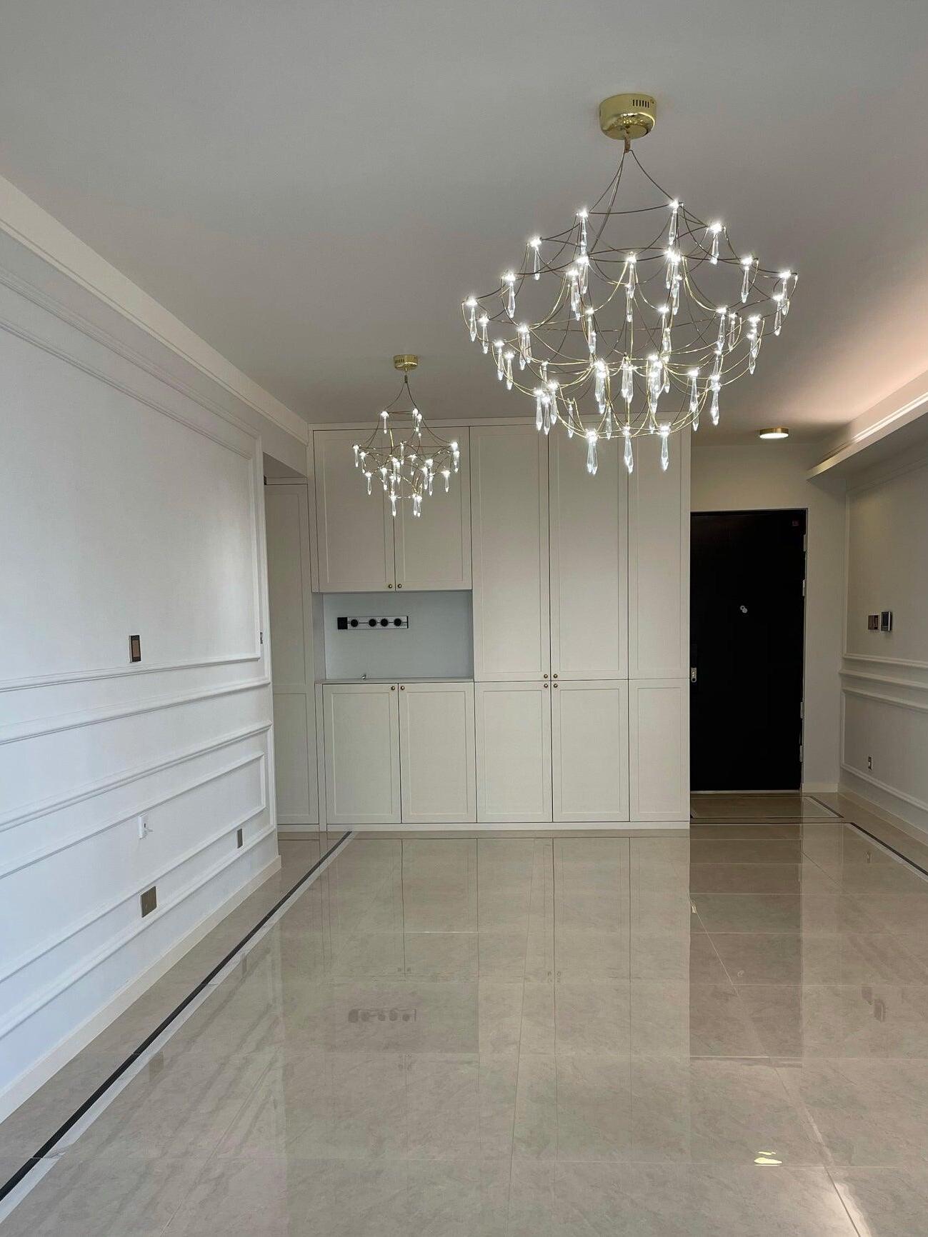 Illuminated crystal chandelier in a hallway