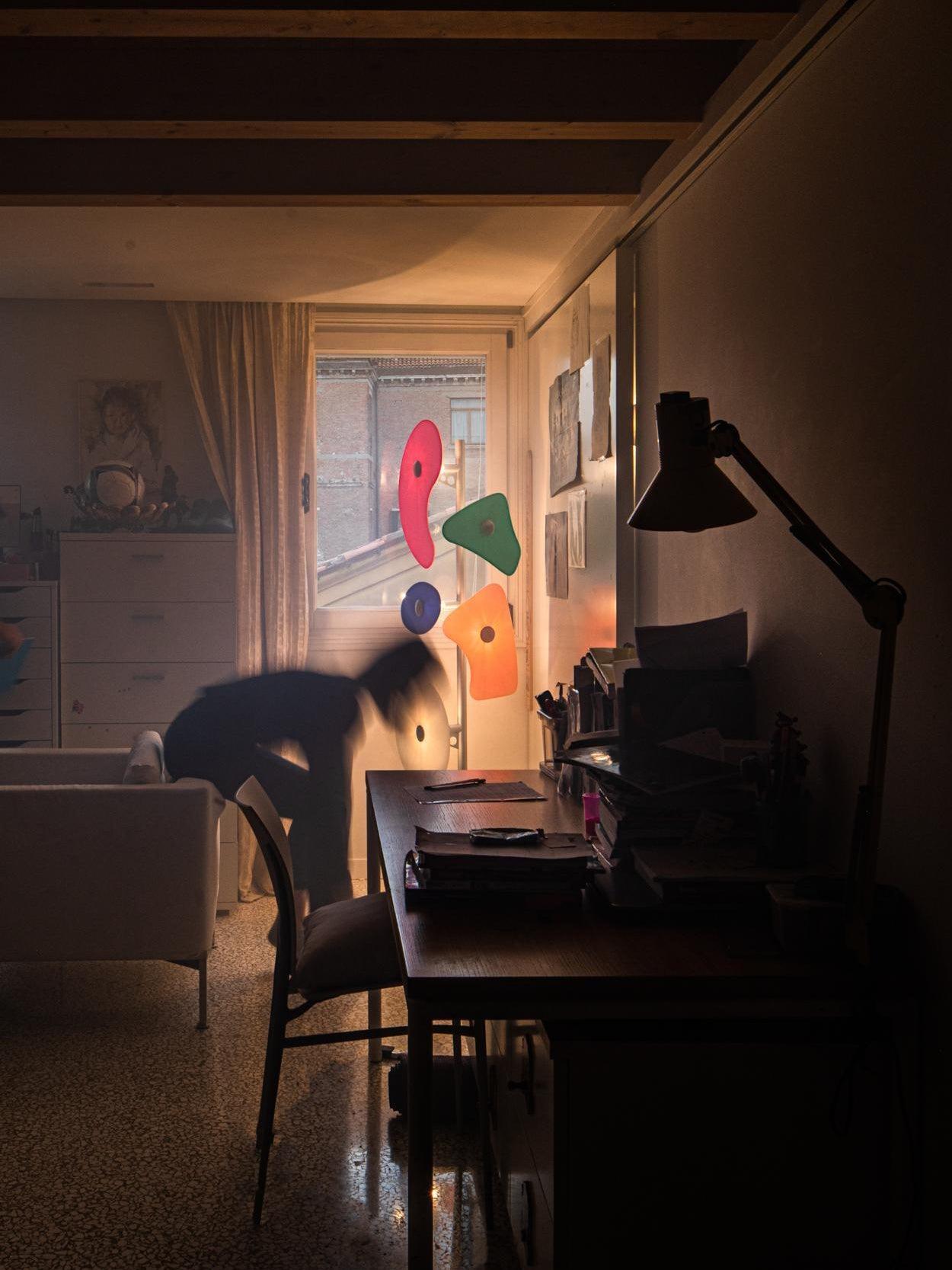 Illuminated multicolour floor lamp in a room