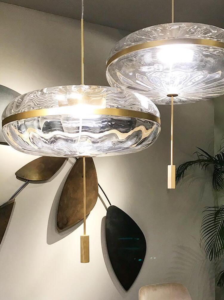 Close view of illuminated glass dome pendants